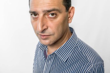 portrait of a funny man on a white background in the studio