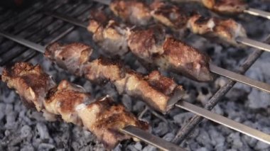Cooking Fresh pork on skewers on charcoal