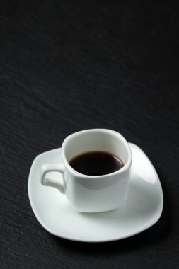 close-up shot of cup of coffee on black background