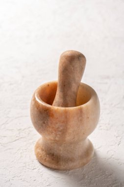 close-up shot of stone mortar on white background