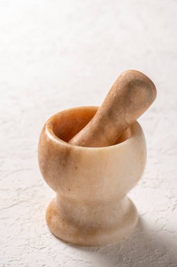 close-up shot of stone mortar on white background