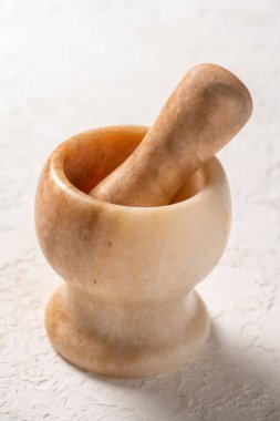 close-up shot of stone mortar on white background