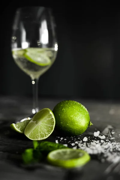 Green Ripe Lime Fruit Salt Foreground Water Glass Drink Black — Stock Photo, Image