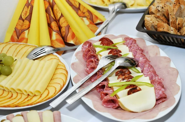 Platters of ham, cheese, salad — Stock Photo, Image