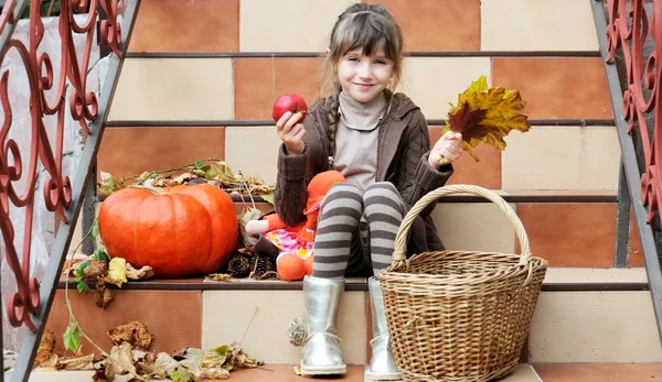 Little girl sitting on stairs outdoors — Stock Photo, Image