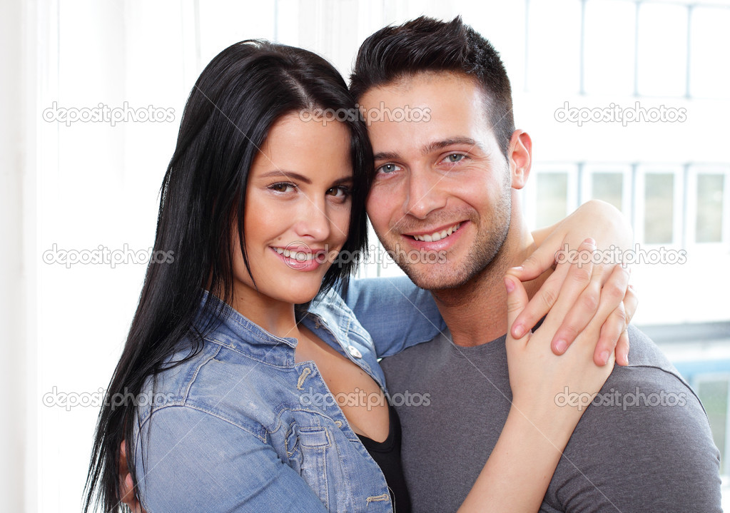 Hugging couple smiling