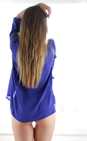 Woman posing in blue shirt top — Stock Photo, Image