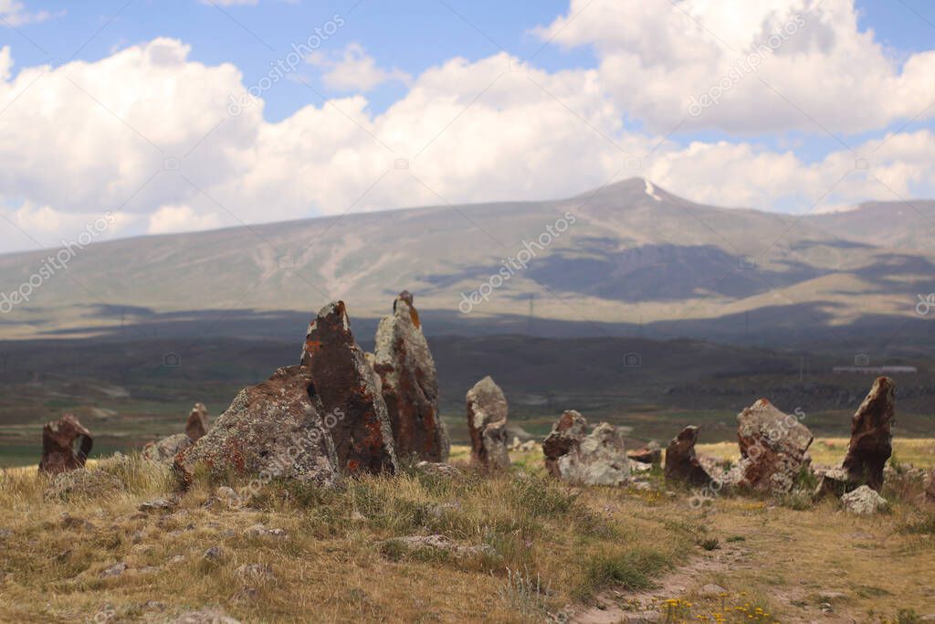 Stones of Zorats Karer in Karahunj on the background of the mountains of Armenia
