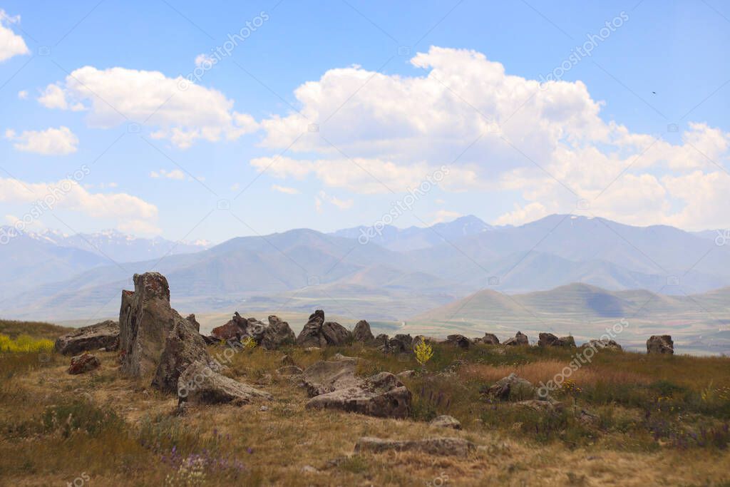 Stones of Zorats Karer in Karahunj on the background of the mountains of Armenia