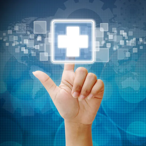 Hand press on First Aid icon — Stock Photo, Image