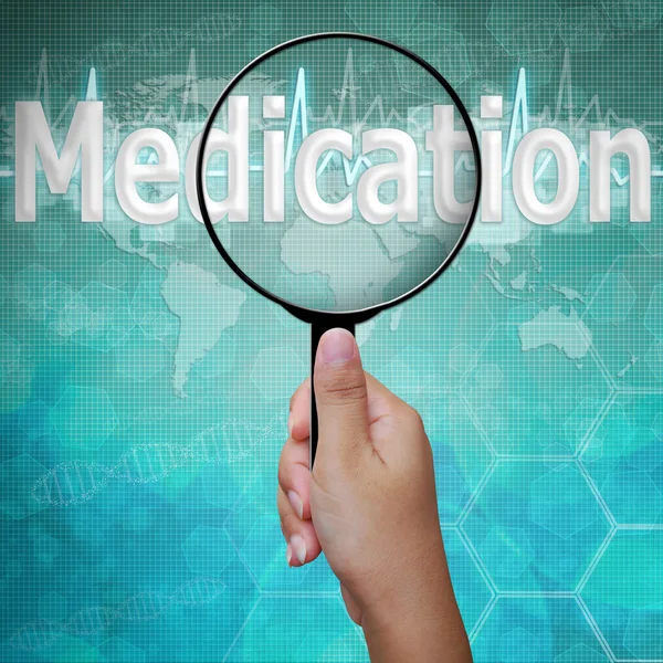 Medicatie, woord in Vergrootglas, achtergrond medical, Inc. — Stockfoto