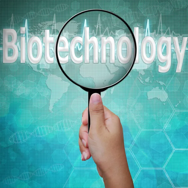 Biotechnologie, mot en verre grossissant, fond médical — Photo