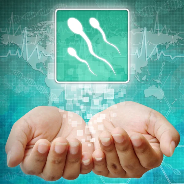 Symbole du spermatozoïde à portée de main, fond médical — Photo