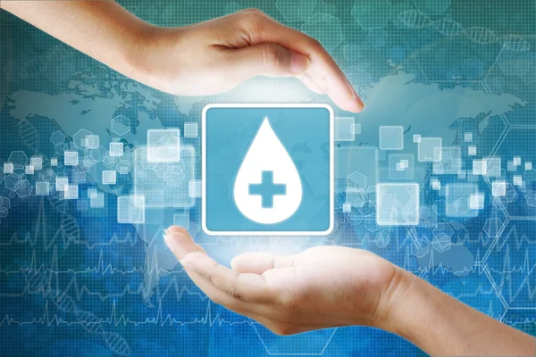 Medische pictogram, doneren van bloed bloed daling symbool in de hand — Stockfoto
