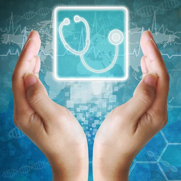 Икона стетоскопа в руке, медицинское образование — стоковое фото