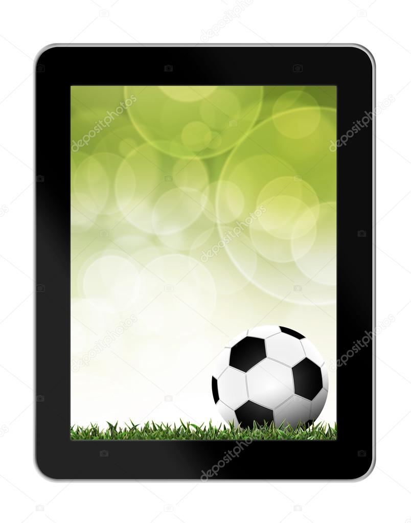 Football in green grass with background in tablet-pc