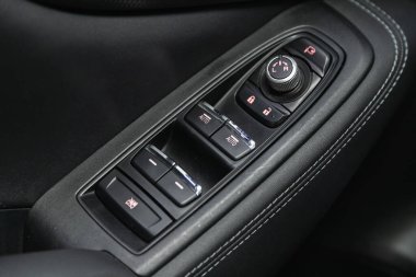 Novosibirsk, Russia - November 04, 2021: Subaru Forester, close-up of the side door buttons: window adjustment buttons, door lock. 