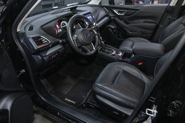 Novosibirsk, Russia - November 04, 2021: Subaru Forester,  steering wheel, shift lever and dashboard, climate control, speedometer, display. Salon of a new stylish ca