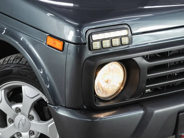 Novosibirsk, Russia - December 01, 2021:  Lada Niva,  Close up of the car headlights. Exterior closeup detail