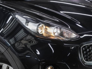 Novosibirsk, Russia - December 09, 2021:  Kia Sportage    ,  Close up of the car headlights. Exterior closeup detail