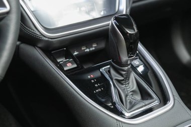 Novosibirsk, Russia - December    01 , 2021:  Subaru Outback  , Close-up view of the automatic gearbox lever. Interior car,  automatic transmission gearshift stick; 