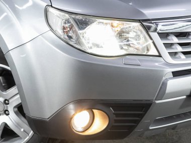 Novosibirsk, Russia - November    04 , 2021:  Subaru Forester,  Close up of the car headlights. Exterior closeup detail