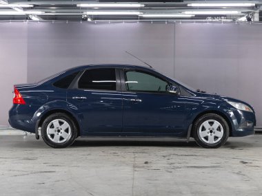 Novosibirsk, Russia - December    01 , 2021: black  Ford Focus, side view.  Photography of a modern sedan  made in Japan on a parking 