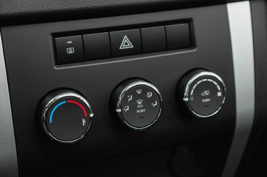 Novosibirsk, Russia - October    24 , 2021:  UAZ Patriot, Black  detail with the air conditioning button inside a car.