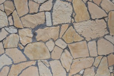 Antika duvar gri taşlarla döşenmiş, üst manzara. Taş dokusu, açık taş döşemeler.