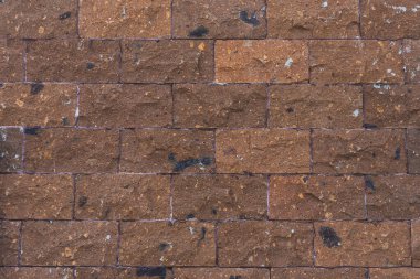 Kahverengi taş duvarın arka planı. Tahta duvar dokusu ve arkaplan deseni 