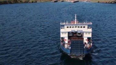 A ferry from the east coast to Olkhon Island Khuzhir at sunrise. Lake Baikal. From the side of the island. Irkutsk region, Russia - August 1, 2021