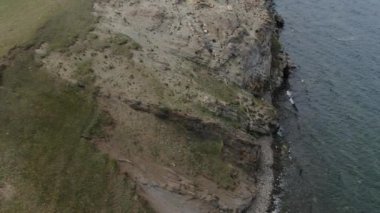 Cinematic aerial view of the high mountains of Siberia. The famous Lake Baikal. Beautiful nature of Asia Russia. Sunny day . 4K drone shooting
