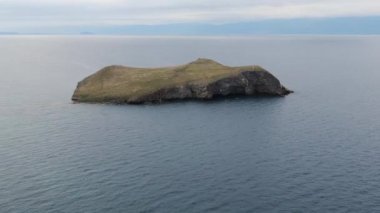 Cinematic aerial view of the high mountains of Siberia. The famous Lake Baikal. Beautiful nature of Asia Russia. Sunny day . 4K drone shooting