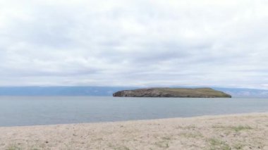 Cinematic aerial view of the high mountains of Siberia. The famous Lake Baikal. Beautiful nature of Asia Russia. Sunny day . 4K drone shooting