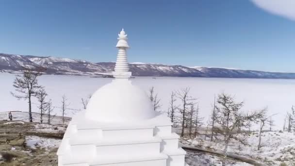 Aerial Cinematic Buddhist Stupa Cliff Top Ogoy Island Winter Frozen — Stockvideo