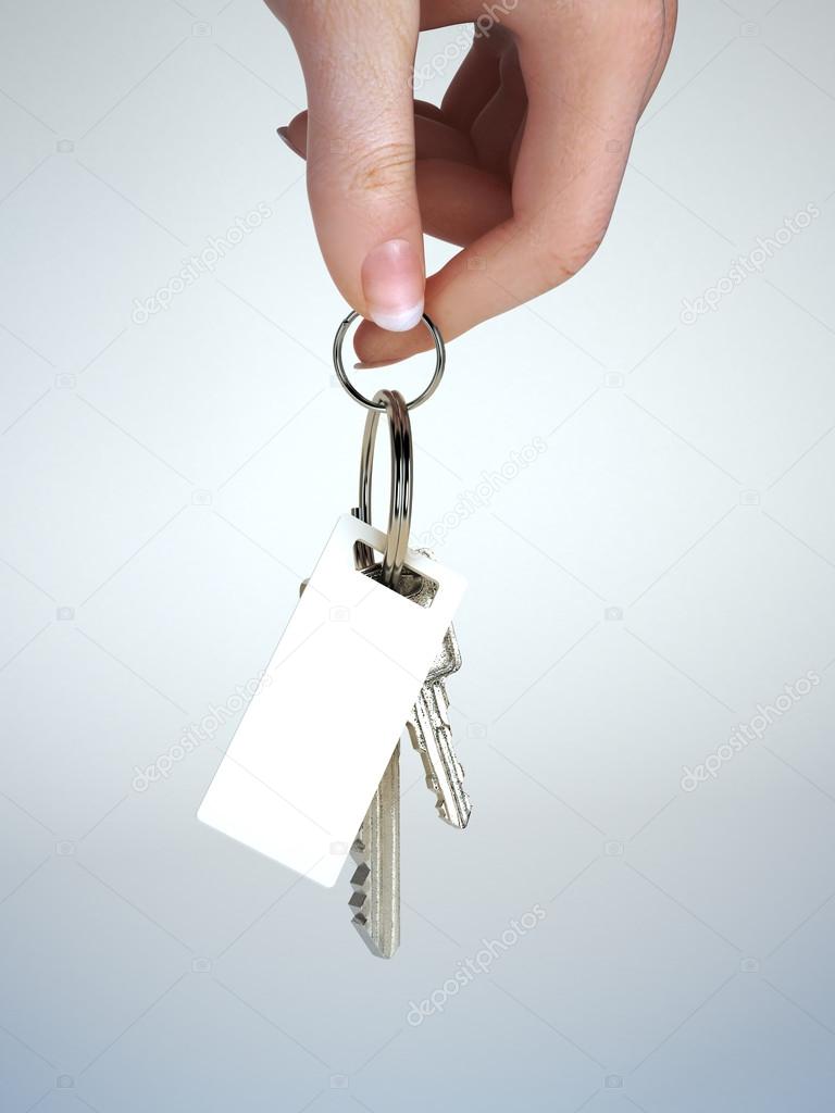 Hand holding keys with key chain