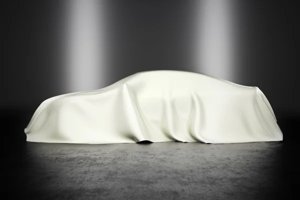 Covered car with studio lighting — Stock Photo, Image