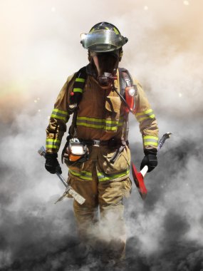 A firefighter pierces through a wall of smoke searching for survivors. clipart