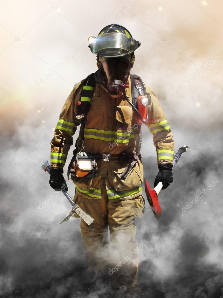 A firefighter pierces through a wall of smoke searching for survivors.