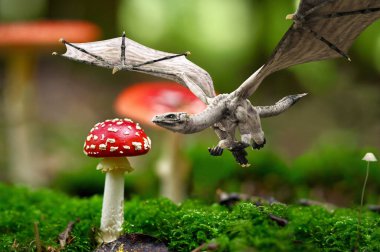 Meraklı bir fantezi minik ejderha daha yakından bakmak için saldırıyor. Alan 3d oluşturma derinliği