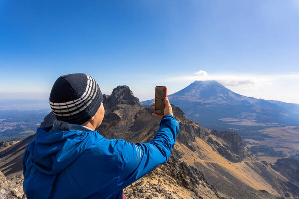Tourist Man taking selfie by smartphone