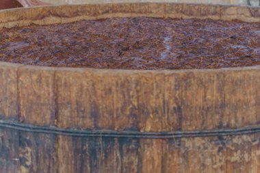 Maguey Fiber Fermenting In Wooden Vats clipart