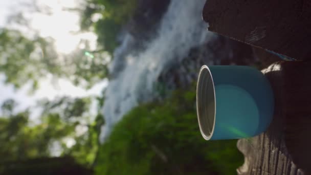 Coffee Thermos Bottle Steel Cup Waterfall Background High Quality Footage — Vídeo de Stock