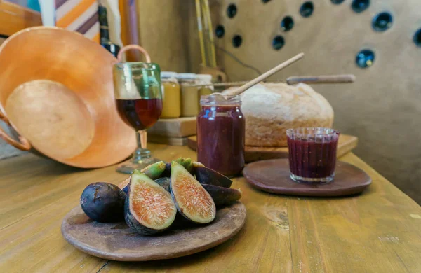 a fig jam and red wine in a jar