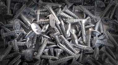 Yeni bir demet küçük metal vida arka plan