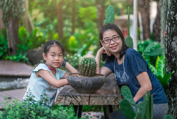 Portrait Asian Middle Aged Mother Daughter Posing Wooden Table Beautiful — стоковое фото