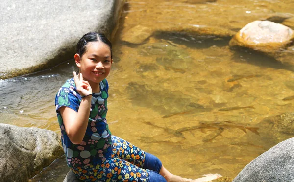 Cute Asian Child Girl Waterfall Sitting Big Rock Smiling Face — стоковое фото