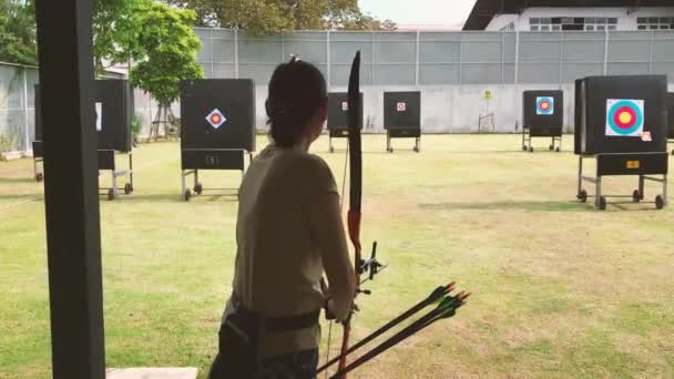 Asian Woman Practicing Archery View Target — Stock video