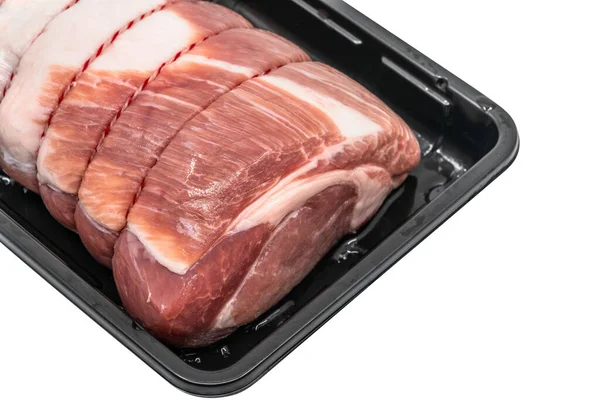 Close up a raw cut of pork loin, tied up and rolled with butcher\'s string in a black plastic container, 45-degree angle view, detailed tissue of fresh pork, the isolated image on white background.