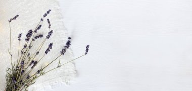 sprigs of lavender on a napkin top view. gentle romantic invitation